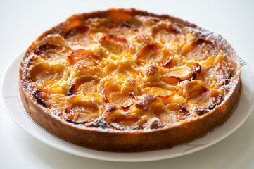 Fresh baked French pie with ripe plums