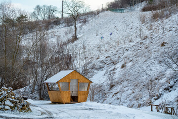 Beautiful winter scenery with a snow-covered gazebo. picnic spots on winter background. winter snow forest
