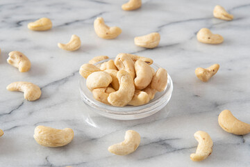 Close-up of cashew nuts in a transparent saucer
