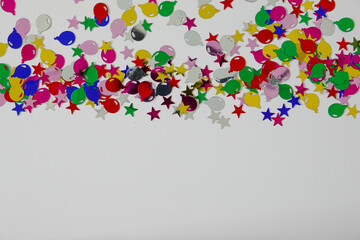A colorful balloon and stars border with copy space.