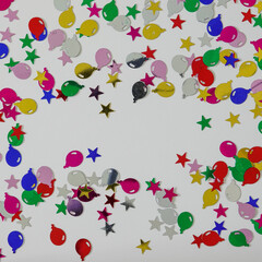 A colorful balloon and stars border with copy space.