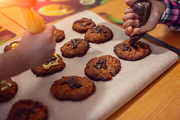 applying the glaze to homemade cookies