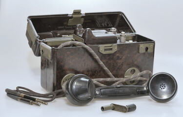 Old military field telephone in box