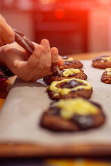 applying the glaze to homemade cookies