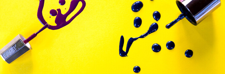 Blots of purple, blue nail polish isolated on bright background.Nail Polish Splashes. art set. Blots of mixed multicolor samples.paint splash isolated on yellow. Web banner.copy space