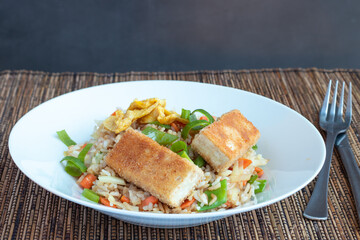 Fried rice with vegetable and tofu in egg and breadcrumbs 