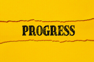 The text PROGRESS appears on torn yellow paper against. A yellow background. Business concept.