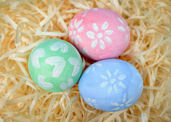 Close up of colorful easter eggs with children drawings. First preparation for Easter