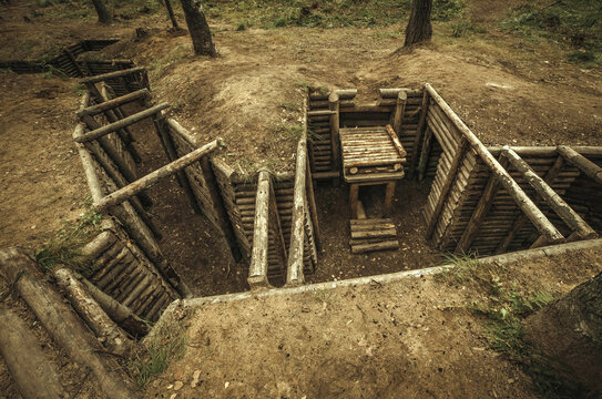 Wooden military dugout made of logs in the forest on the Mannerheim line