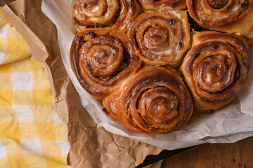 Fresh flavored cinnabona cinnamon rolls. Sweet and delicious cinnamon. Homemade baked goods on craft paper.