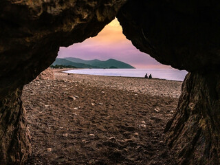A colorful morning scene from a beach in south Turkey, taken through an opening between the rocks