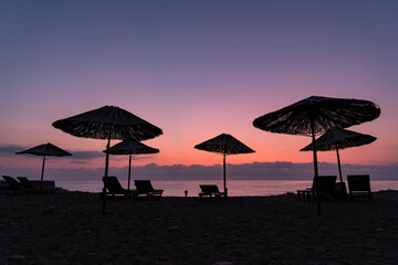 A beach in south Turkey with sunbeds and sunshades, taken right before sunrise