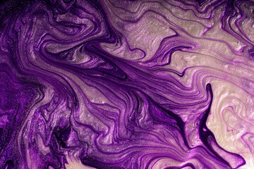 Beautiful textured violet stains of liquid nail polish,fluid art technique.Shimmer marble...