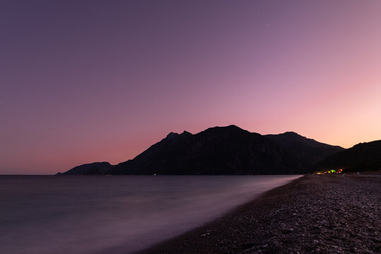 Long exposure image at dusk time from a pebble stone beach in south Turkey