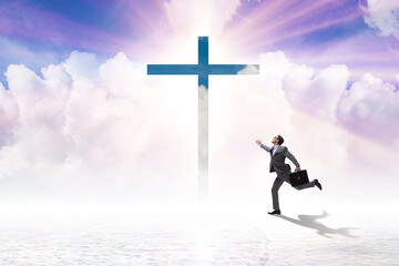 Religious concept with cross and lonely man