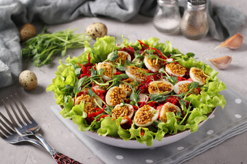 Salad from organic lettuce leaves, peas microgreen, carrots and quail eggs, seasoned with mustard and olive oil, Horizontal format, Closeup