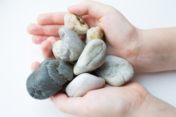 Fototapeta na wymiar hands holding stones