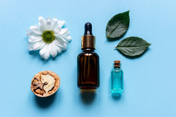 perfume from natural ingredients on a blue background close up