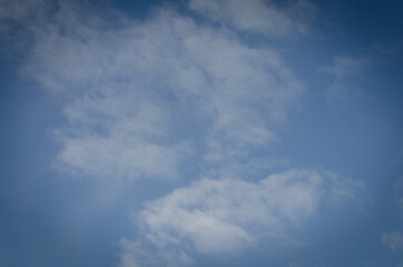 White clouds in the blue sky.