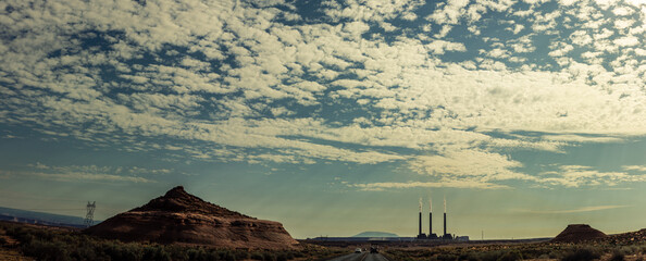 Panorama shot of chocolate factory in american desert with clouds on sky in arizona, usa