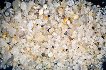 Sand grains from Cape Cod enlarged with a microscope.