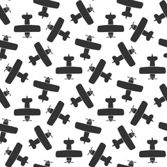 Black airplanes biplanes isolated on white background. Cute monochrome seamless pattern. Vector simple flat graphic illustration. Texture.