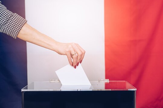 Ballot Voting. Politics Choice Election. Woman throwing his vote into the ballot box.