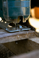 Jigsaw going through a wooden pallet.

