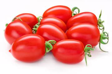 Bunch of San Marzano tomatoes. Whole plum cherry juicy tomato isolated on white. Italian fresh vegetables. Organic raw vegan healthy food vegetable. Farm market product. Front view, macro, studio