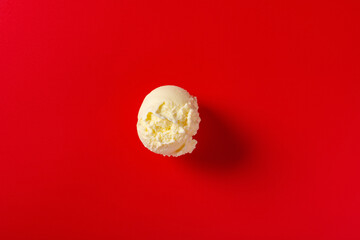 top view fresh vanilla flavor ice cream ball on red background