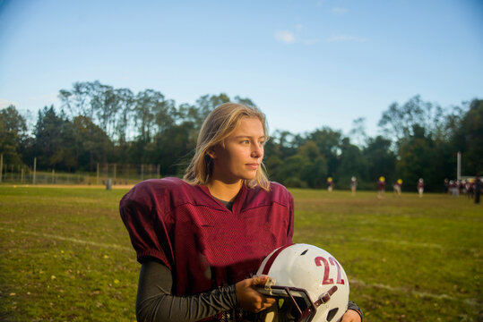 Teenage female football player on field