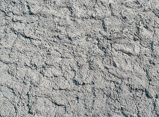Vintage brick wall texture background with crumbling plaster. Background with large cracks. Grunge Urban Art Poster.