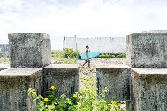 Man with surfboard, Abulug, Cagayan, Philippines