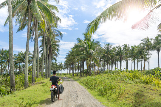 Motorcyclist with surfboard, Abulug, Cagayan, Philippines