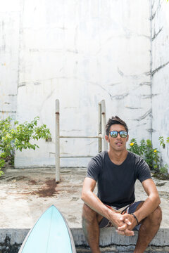 Man with surfboard, Abulug, Cagayan, Philippines