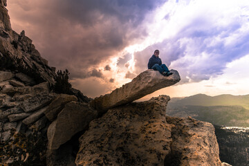Climber resting on peak, Tuolumne Meadows, Yosemite National Park, California, United States
