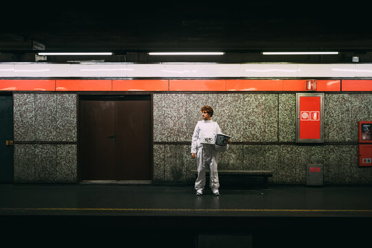 Astronaut waiting on train platform