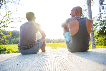 Friends talking on steps, Pagudpud, Ilocos Norte, Philippines