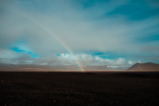 Rainbow over black beach, Sólheimasandur, Vík, Eyjafjardarsysla, Iceland © Image Source