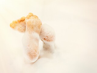 bath foam. baby hands in bubble bath, baby washing in bubble bath