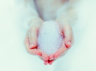 bath foam. baby hands in bubble bath, baby washing in bubble bath