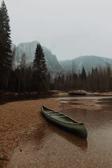  Canoe beached on river shallows, Yosemite Village, California, USA © Image Source