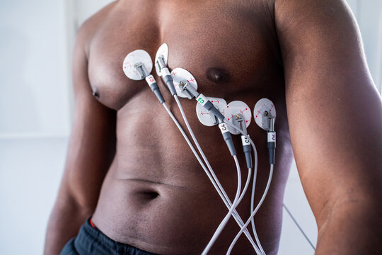 Patient undergoing ECG test in consultation room