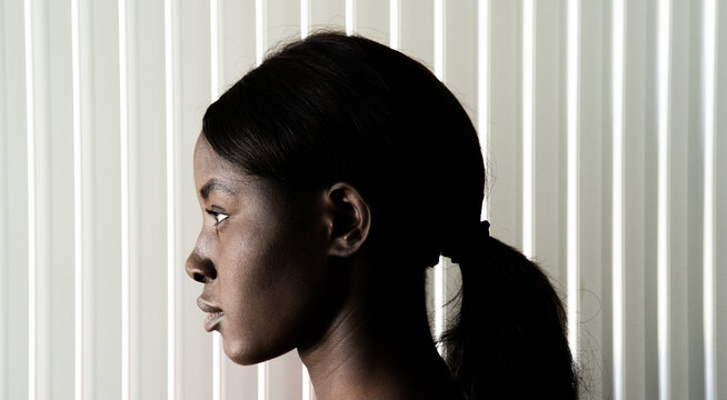 Young woman with ponytail, head profile portrait