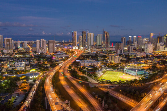 Highways intersections merging with Highway US 1 through downtown Miami at night, aerial view, Miami, Florida, United States