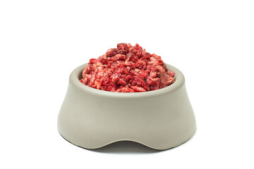 Natural pet food. Fresh raw minced meat in bowl on white background. 