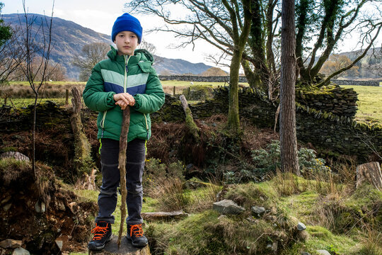 Boy exploring national park, Llanaber, Gwynedd, United Kingdom