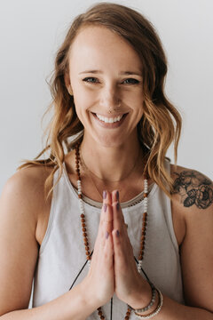 Portrait of woman in prayer pose