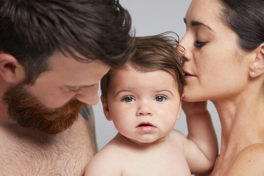 Portrait of couple and baby girl