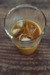 cold brew coffee with ice cubes in glass from topdown view., drinks and beverages series